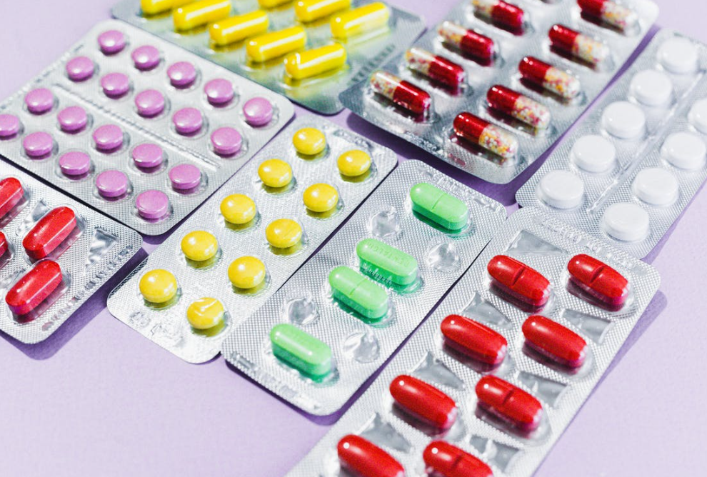 15 Warning Signs of Teen Drug Use 1 Colorful assortment of pills in various shapes and sizes on a white background, representing PexelPills.