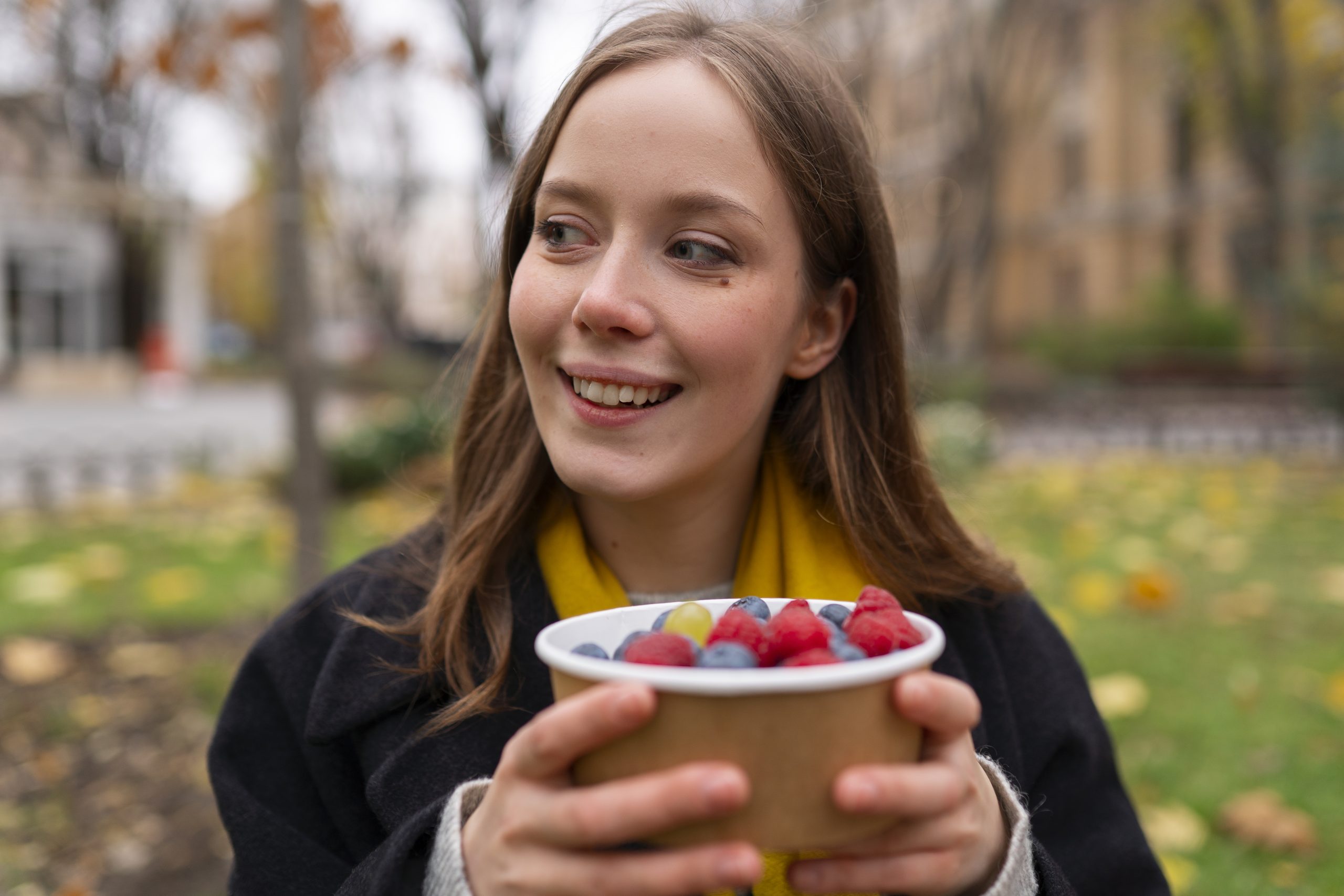 A colorful assortment of fresh fruits including apples, bananas, and berries, highlighting nutritional needs for teen growth.