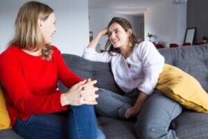A parent and teen engaging in a conversation, illustrating how to build trust with your teen through open dialogue.