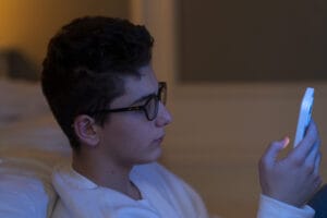 are ai companions safe for teens - A vibrant illustration of a friendly AI companion engaging with a teen, exploring if AI co