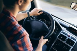 A serene scene of a car parked on a quiet street, illustrating how to ease teen driving fears with calm practice.