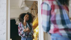 cute fall dresses for teens - A stylish teen wearing a cute fall dress, showcasing vibrant autumn colors and a cozy outdoor s