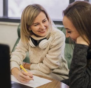 A diverse group of teens engaged in a teaching workshop, exploring skills for helping teens explore teaching careers.