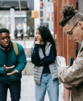 A concerned parent talking to a teenager, highlighting emotional red flags for teens and the importance of open communication