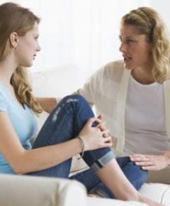 A group of diverse teenagers engaged in a supportive discussion, reflecting the theme of TeenParentChat.